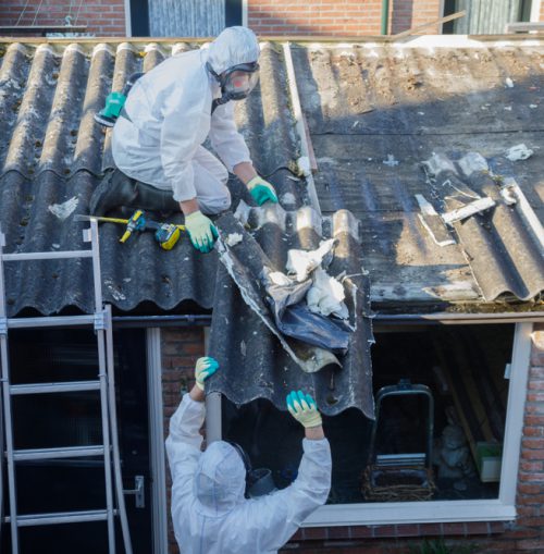 Professional,Asbestos,Removal.,Men,In,Protective,Suits,Are,Removing,Asbestos